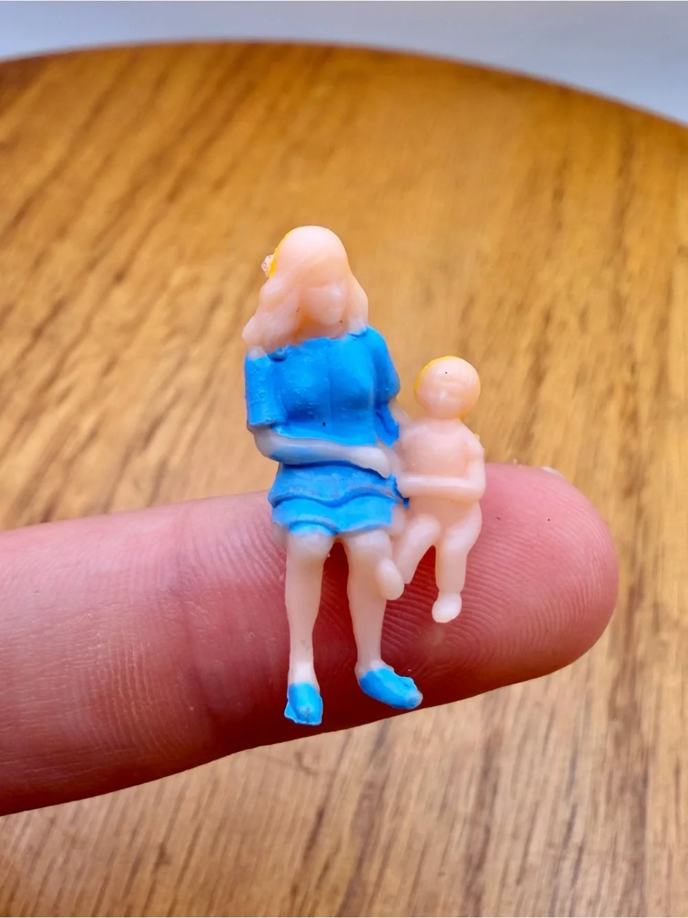 Vintage Plastic Celluloid Painted Woman Holding Child Figure Sitting Trinket 1”